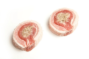 Belly pork and stuffing isolated on a white studio background.