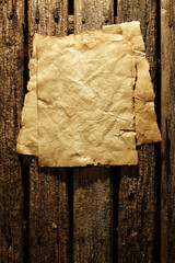 Old paper on wooden wall