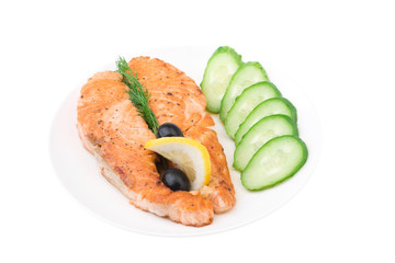 Appetizing Grilled Salmon with sliced cucumber, lemon and black