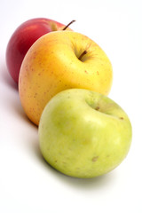 three multicolored apples in a row