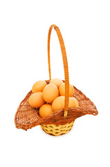 Basket full of eggs isolated on white