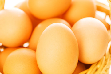 Many brown eggs in the basket - shallow DOF