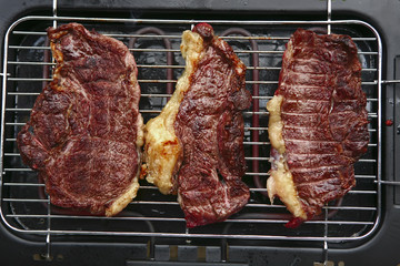 roast steak's on electrical brazier