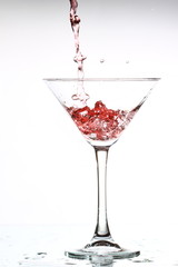 red cocktail on white