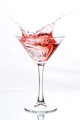 red cocktail on white