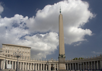 Colonnade of st. peter's basilica square with obelisk