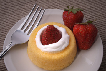 Strawberrie Short Cake with strawberries on side and Fork
