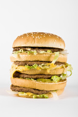 triple cheeseburger isolated on a white background