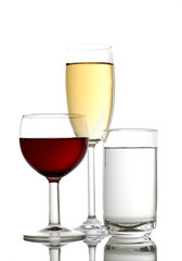 Red wine, apple juice and mineral water in glass