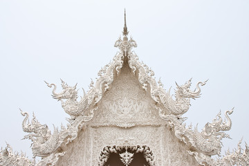 Details of top front of famous white church of Wat Rong Khun