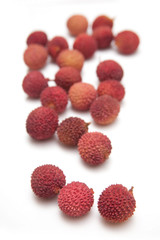 Lychees isolated on a white studio background.