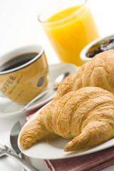 delicious continental breakfast of coffee and croissants