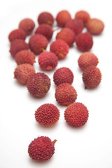 Lychees isolated on a white studio background.