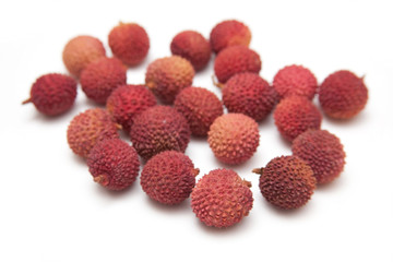 Lychees isolated on a white studio background.
