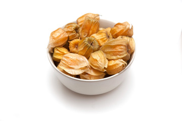 Bowl of Physalis isolated on a white studio background