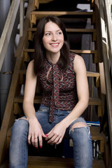 Young attractive smiling woman sitting