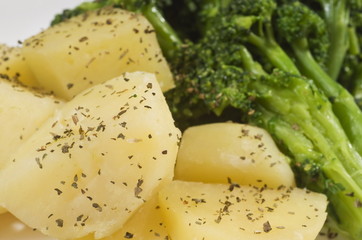 Close up of cooked broccoli and potatoes