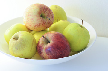 red apple and green apple in the Bowl