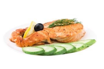 Appetizing Grilled Salmon with sliced cucumber, lemon and black