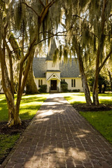 Small Church Down Brick Path Past Spanish Moss