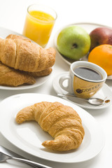 delicious continental breakfast of coffee and croissants