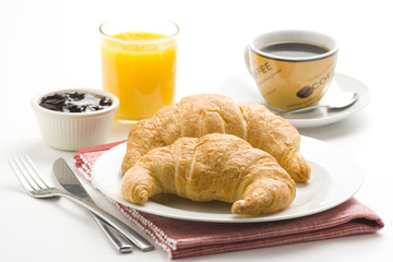 delicious continental breakfast of coffee and croissants