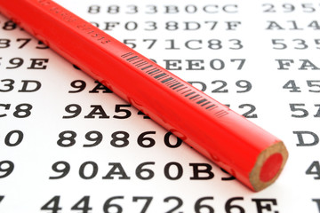 A red pencil on a sheet with encrypted data