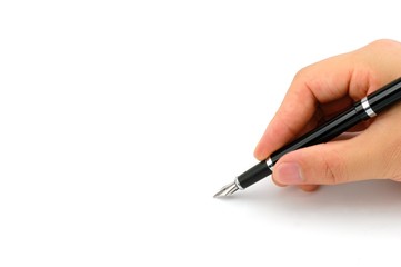 Fountain pen in hand isolated on white background