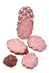 Cutting sausage on white closeup