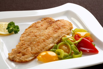 Fried fish fillet with vegetables