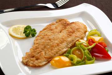 Fried fish fillet with vegetables