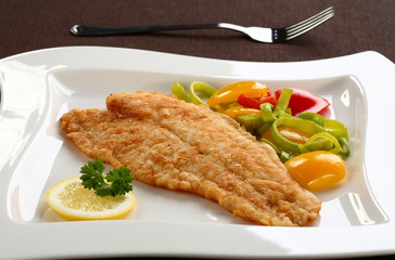 Fried fish fillet with vegetables