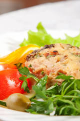 backed meat with green salad