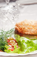 backed meat with goblets on background