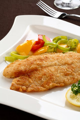 Fried fish fillet with vegetables