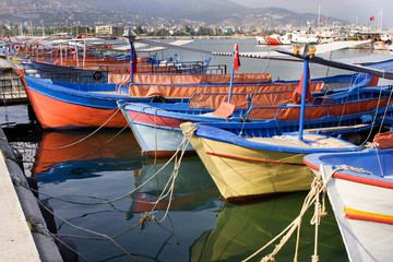 Fototapeta na wymiar Sailing vessels in the harbor of the Turkish city