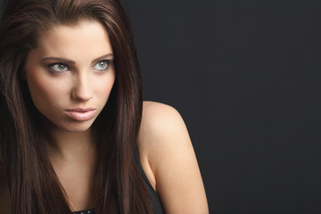 Fototapeta premium Close-up studio portrait of a sexy young smiling woman.
