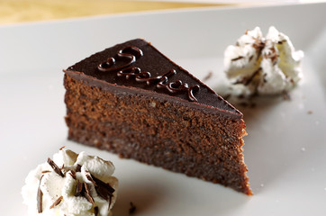 Chocolate cake on white plate