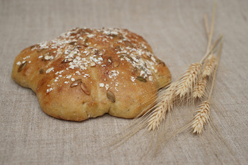 Figured loaf of bread and wheatears