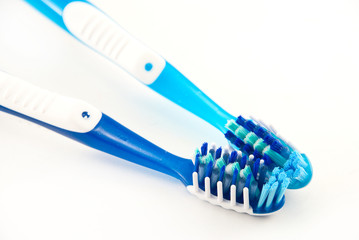 two toothbrushes on a white background