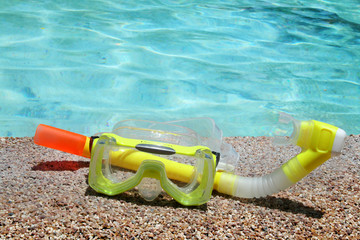 diving mask on a tropical beach