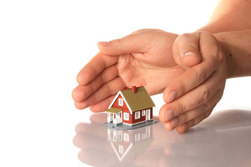 Hands and little house.