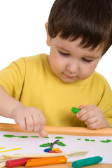Boy playing with plasticine
