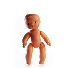 standing plastic baby isolated on white