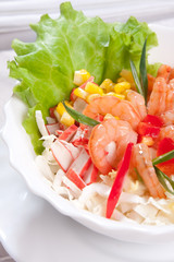 delicious salad with prawns and corn close up