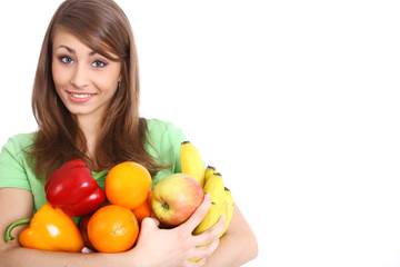 Portrait of a girl holding  in hands full of different fruits