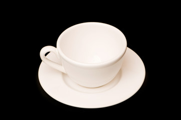 White cup isolated on the black background