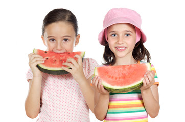 Two beautiful girls eating watermelon
