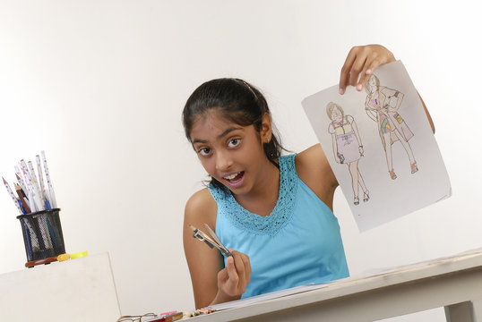 girl showing fashion sketches