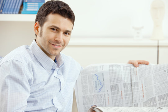 Man reading business news